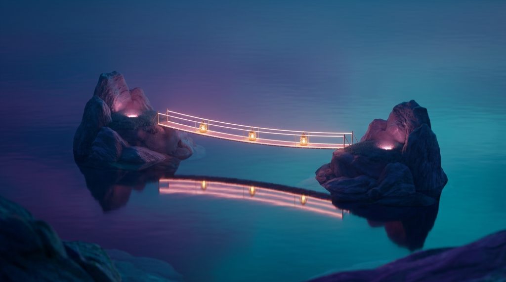 Two small rocky islands on a calm sea at dusk joined by a slender footbridge of warm lantern light